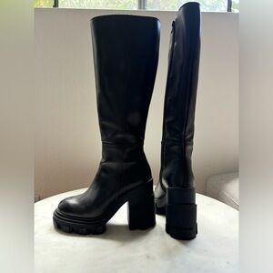 Parallel black leather boots